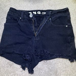 Black high rise denim Jean shorts. Size 3/26 in Woman’s. Shredded at the bottom.
